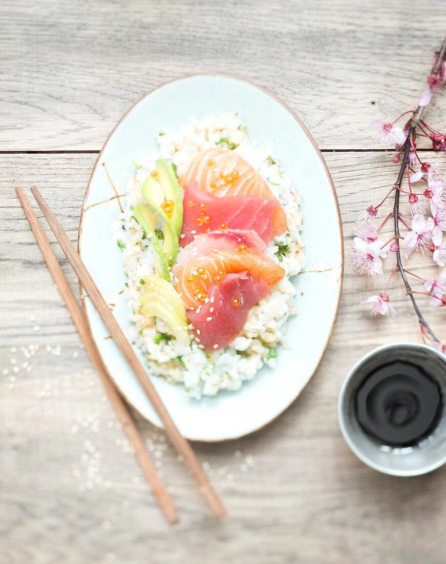 Salmon tuna sashimi on rice salad