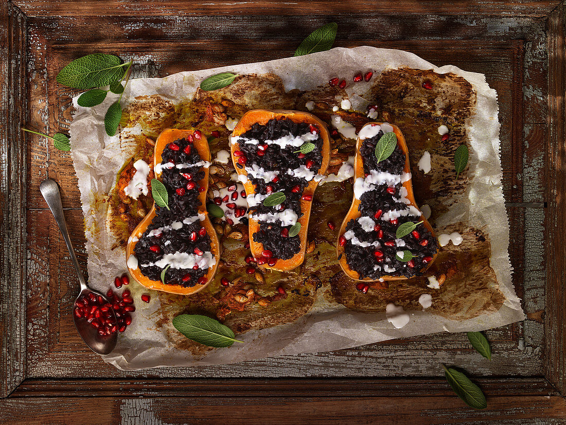 Butternut stuffed with black rice, sage and pomegranate