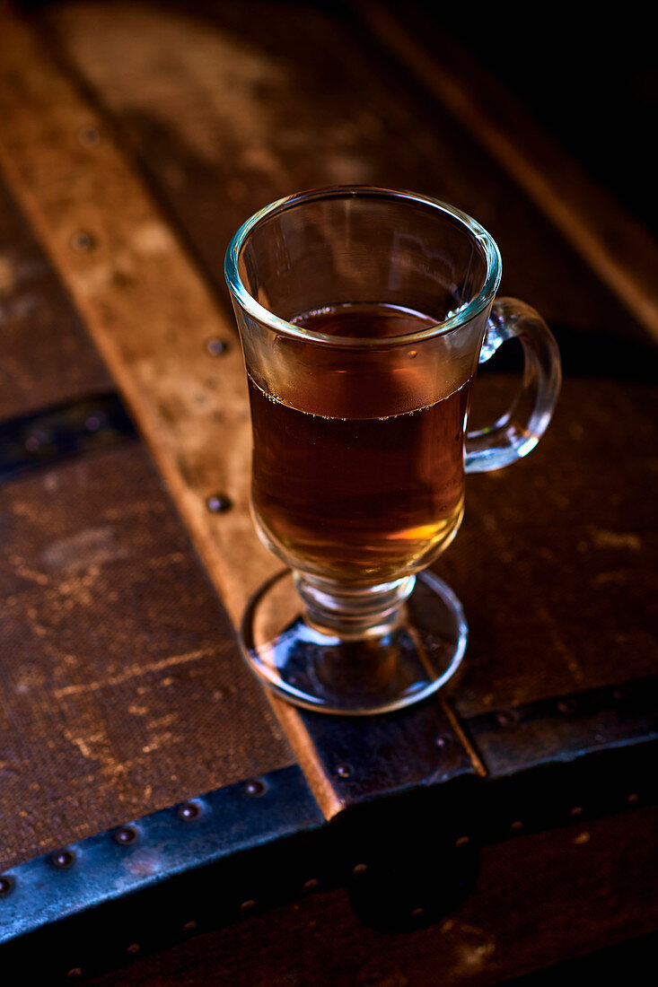 Herbal tea in a glass mug