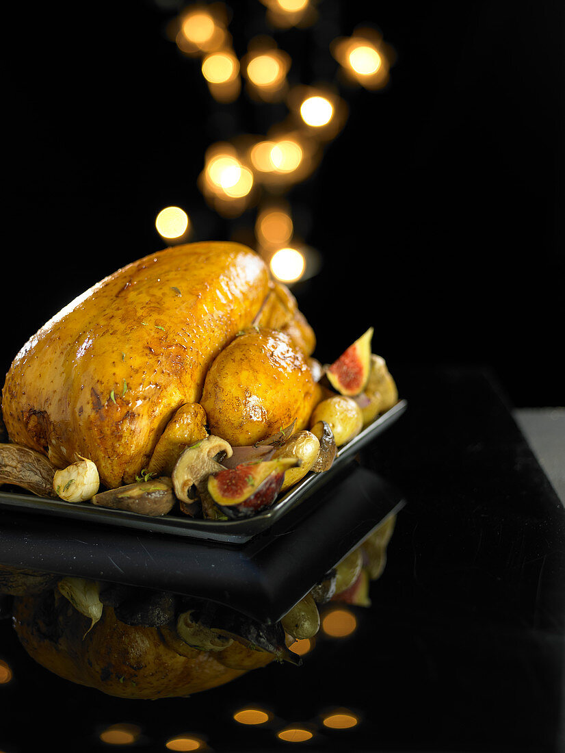 Christmas capon with figs and mushrooms