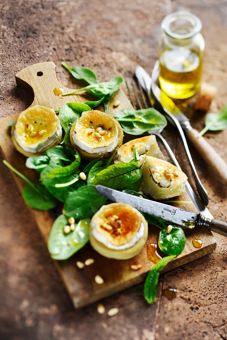 Roasted artichokes with goat's cheese and pine nuts