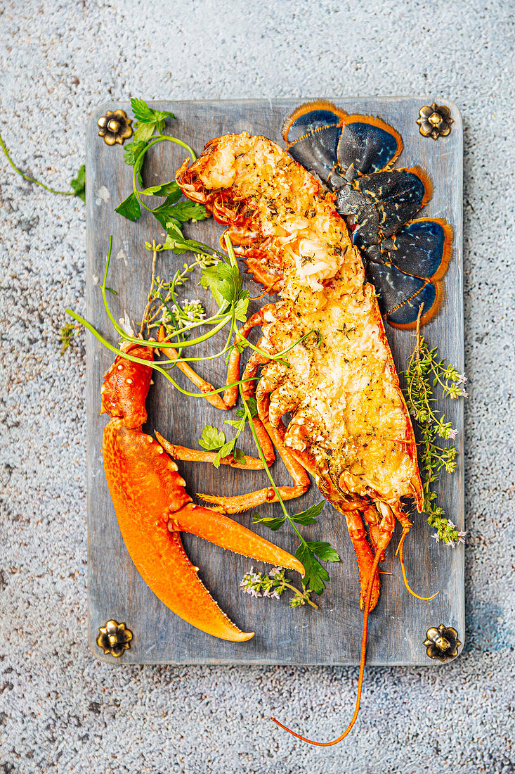 Grilled lobster topped with breadcrumbs and olive oil