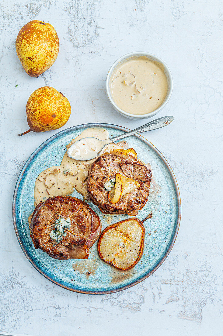 Beef Medaillons stuffed with pears,Roquefort sauce,shallots,Cognac and cream