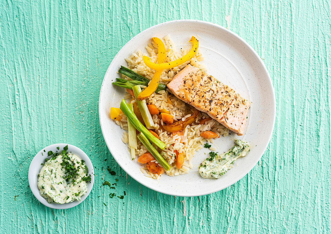 Salmon steak with herbs, rice and vegetables
