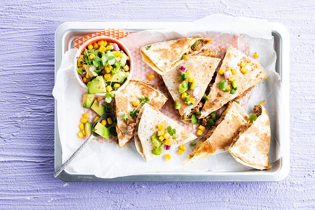 Mexican Quesadilla with minced meat and avocado corn salad