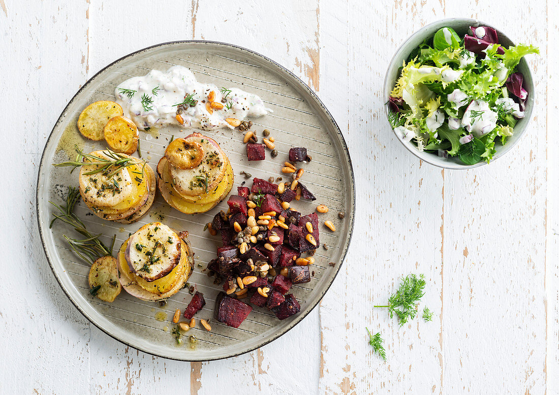 Potato and onion mille-feuille and beet salad with pine nuts