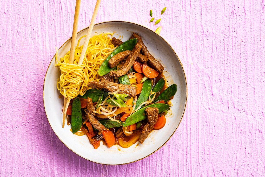 Beef stir-fry with vegetables and Asian noodles