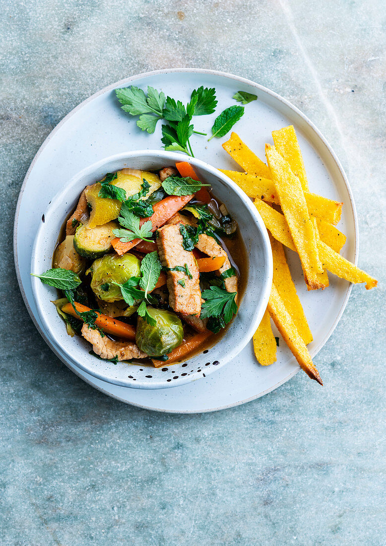 Pork stew with Brussels sprouts, carrots and yellow lemon