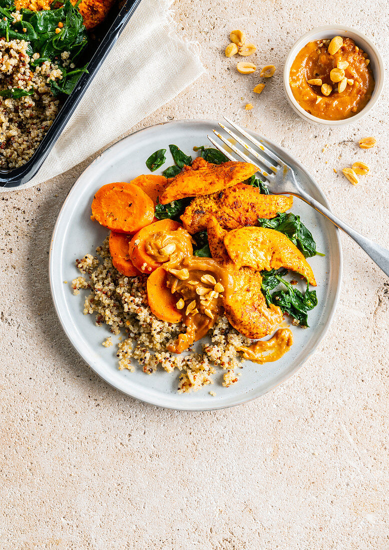 Chicken breast with quinoa and carrot peanut sauce