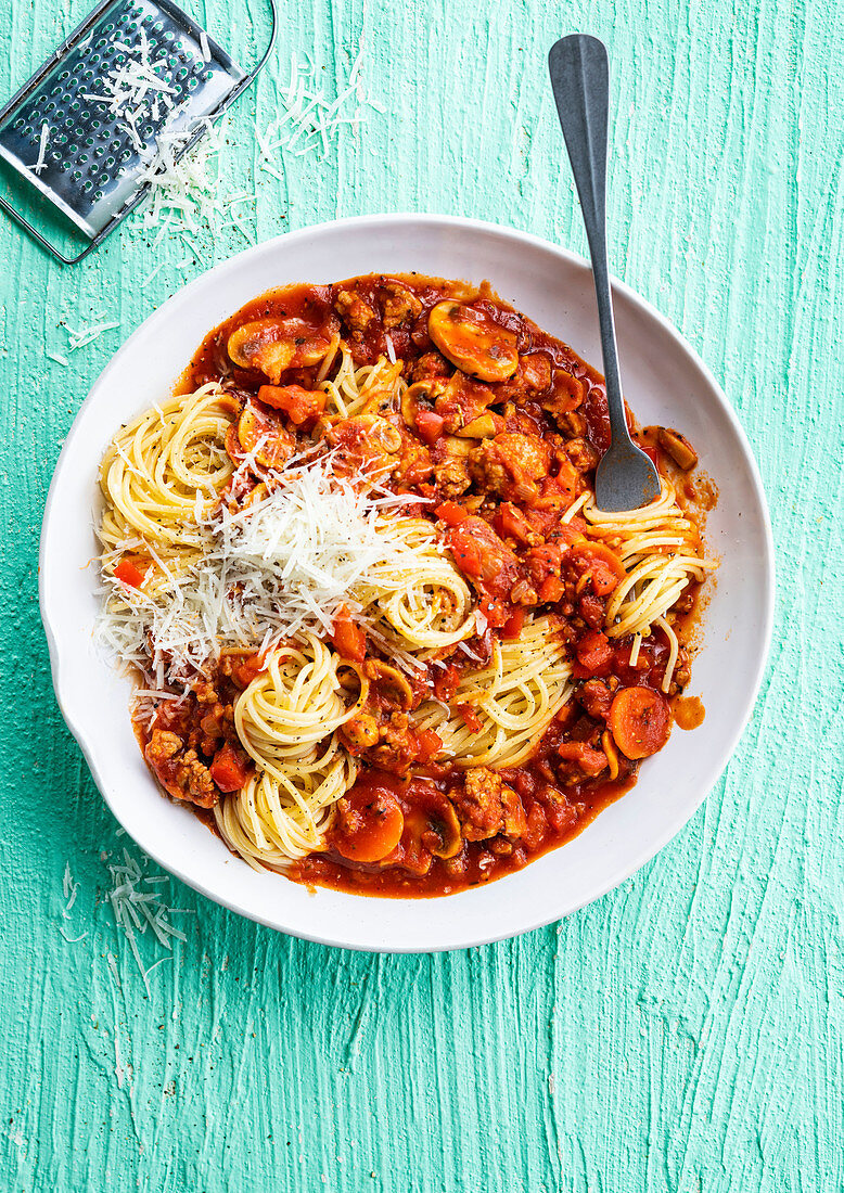 Classic spaghetti bolognese with minced meat and cheese