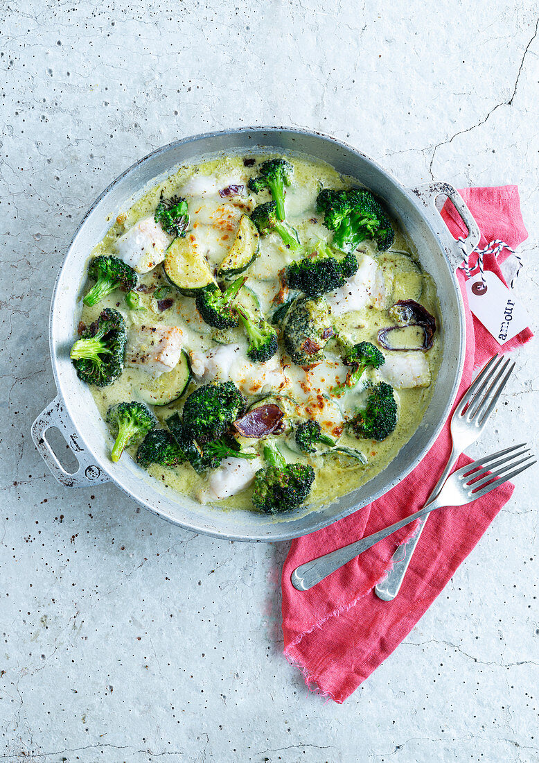 Fish casserole with broccoli, zucchini, pesto and mozzarella sauce