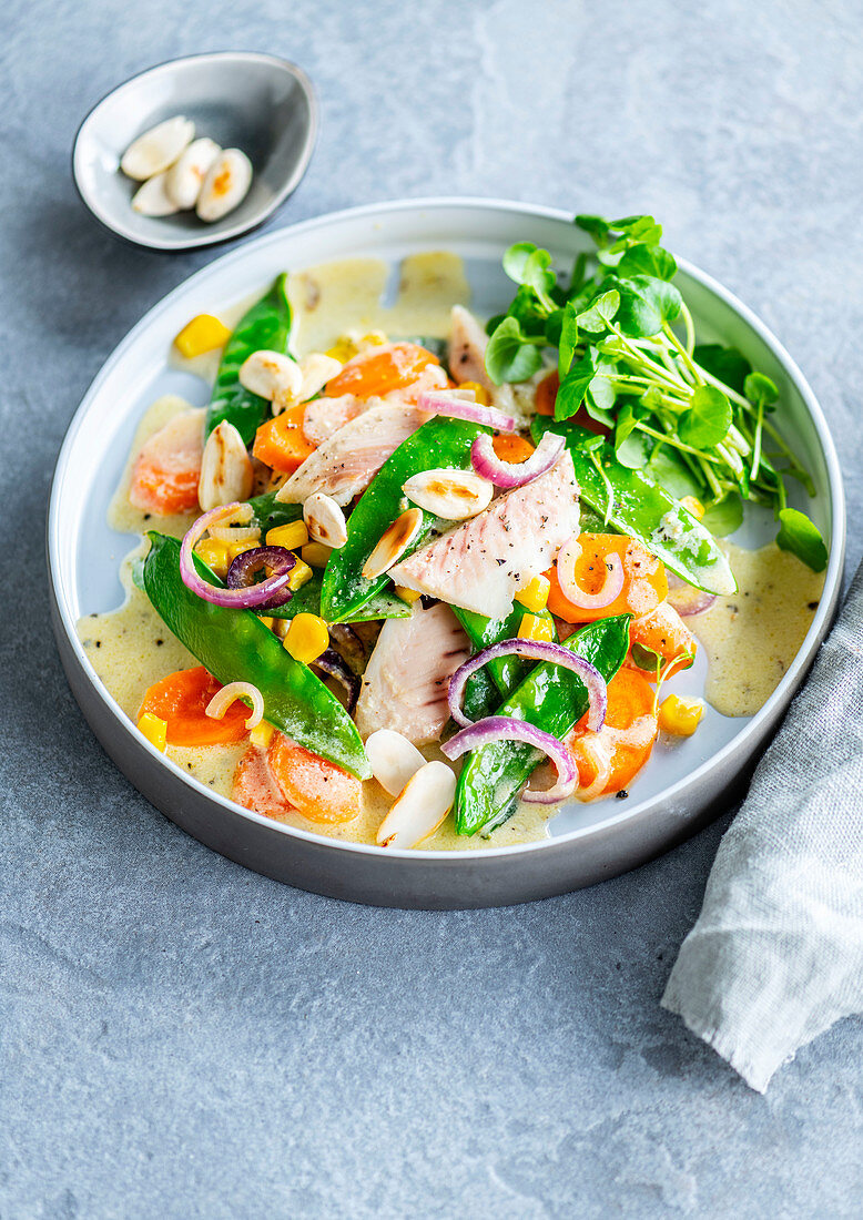 Trout salad with snow peas, carrots and almonds