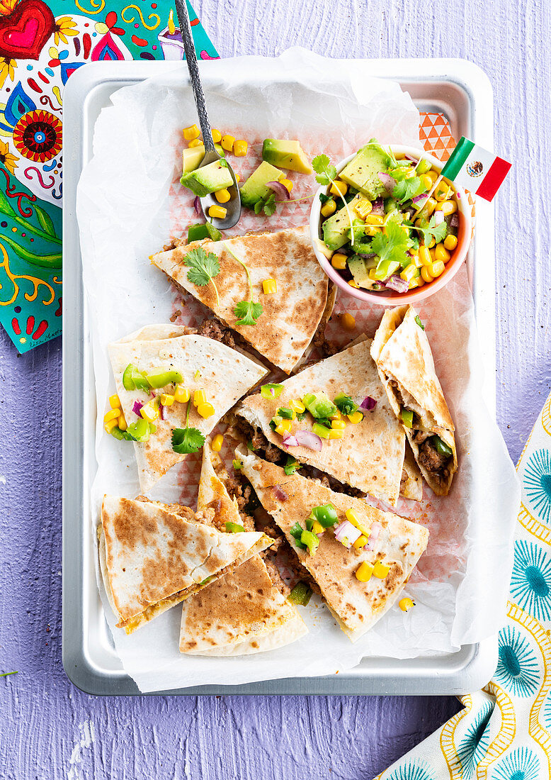 Quesadilla with minced meat and avocado-corn salad