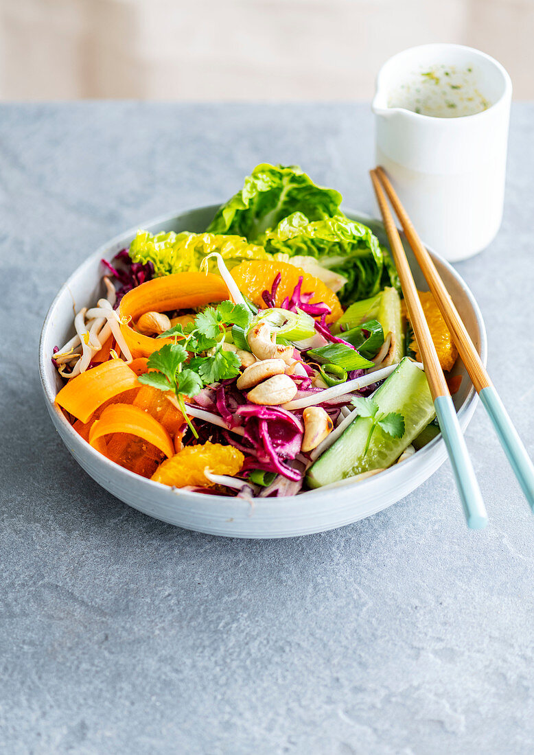 Mixed salad, lettuce, red cabbage, carrot, cucumber, soy and orange