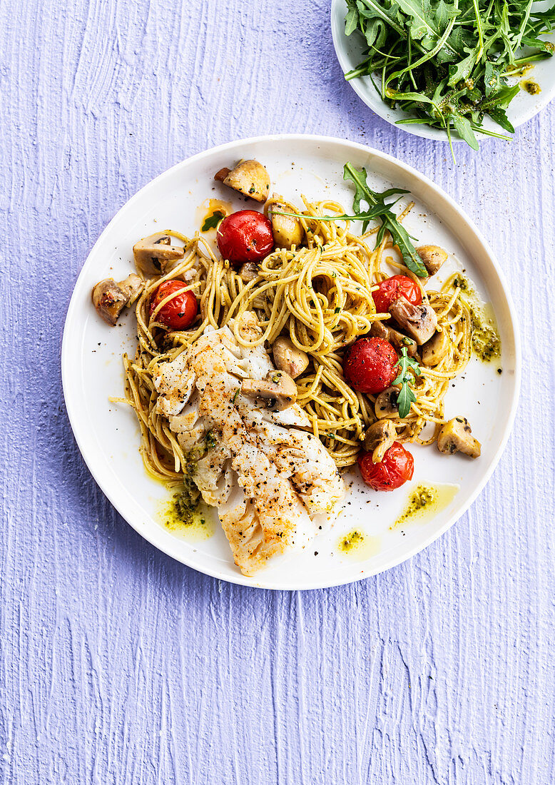 Spaghetti with pesto and fish with roasted cherry tomatoes