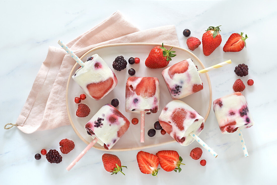 Yoghourt and red fruit ice cream lollipops