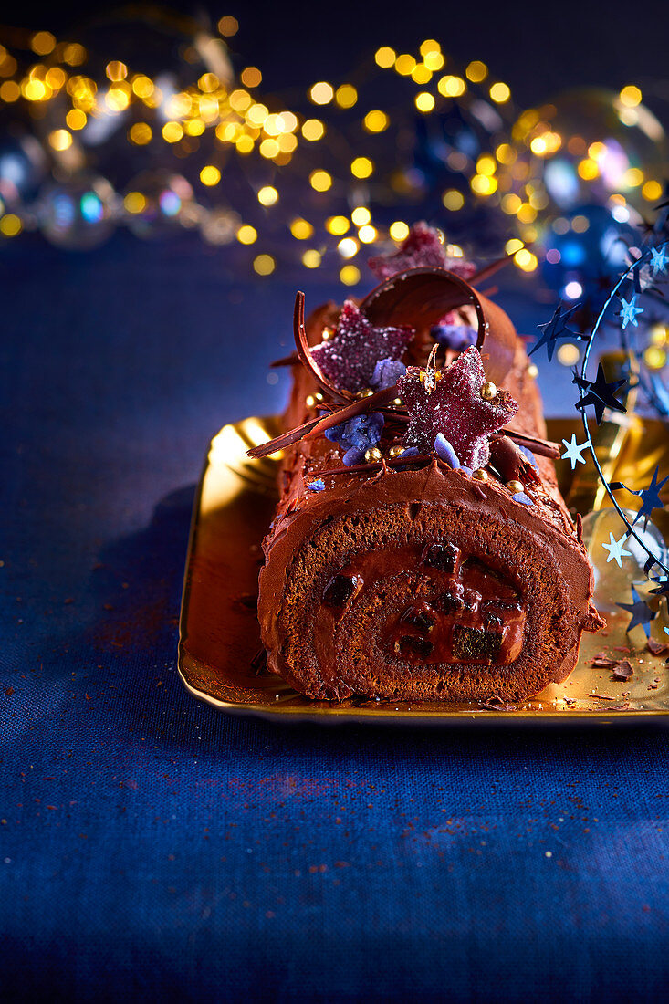 Chocolate and blackcurrant Christmas log cake