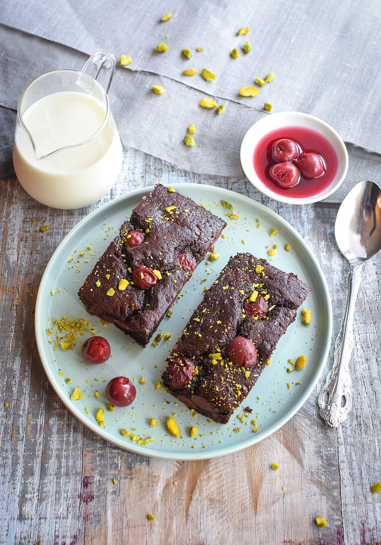 Chocolate,griotte cherry and pistachio batter puddings