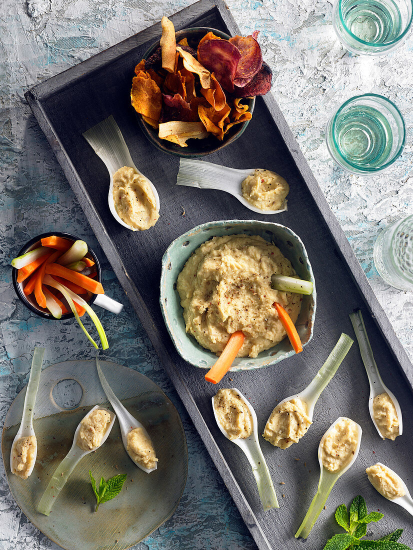 Aperitif tray with hummus,vegetable crisps and dips