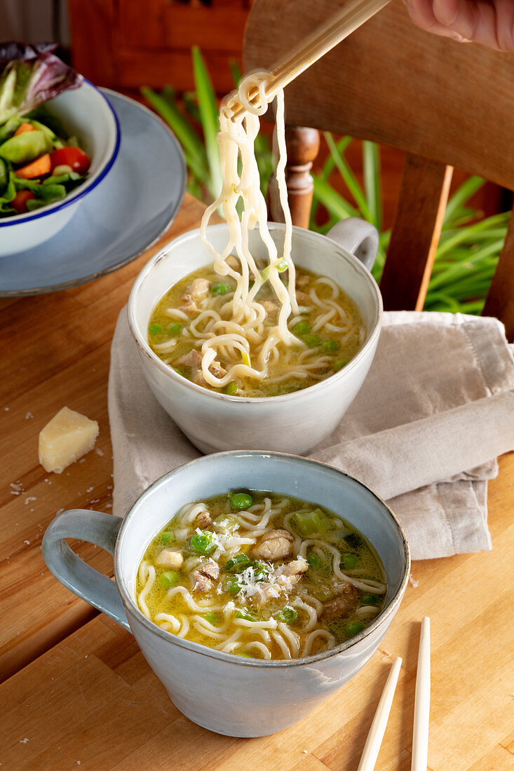 Chicken and pea broth with parmesan