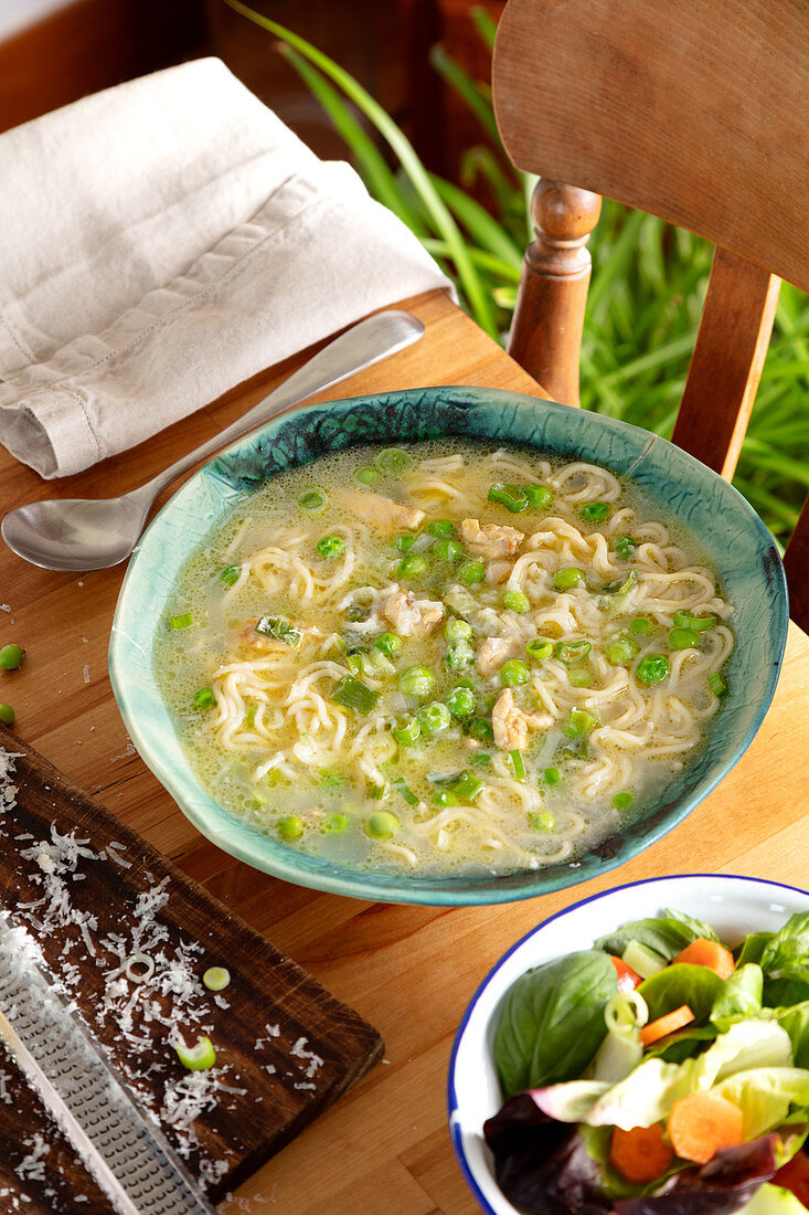 Chicken and pea broth with parmesan