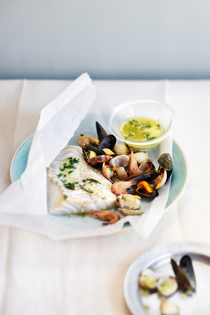 Cod and mussels cooked in paper