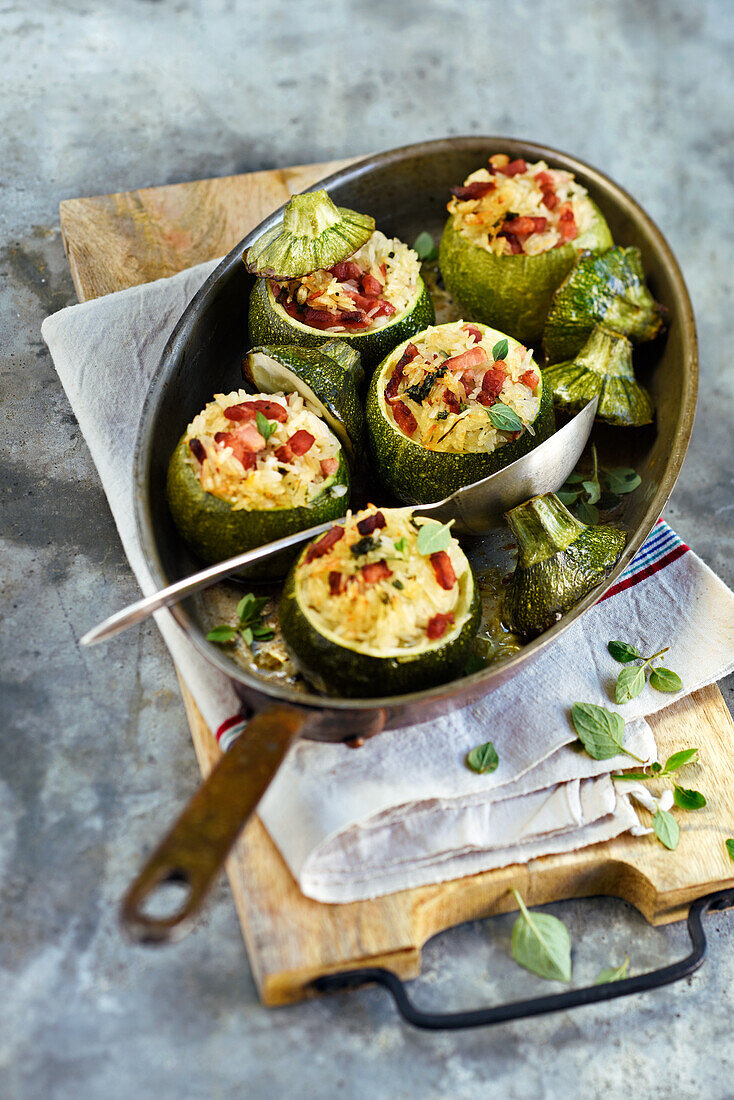 Round zucchini stuffed with rice and bacon