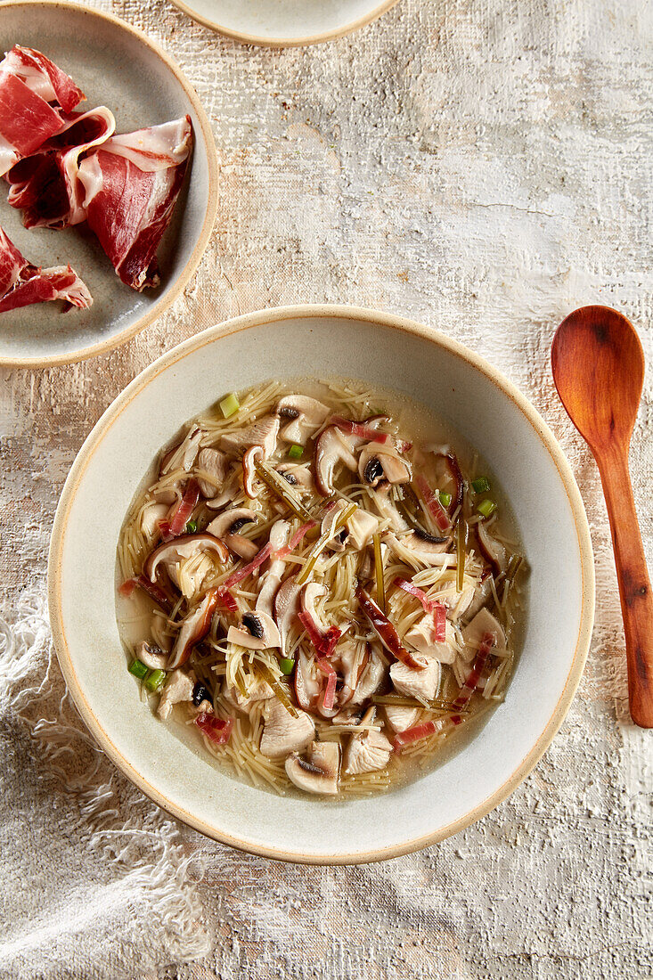 Chicken soup with noodles and mushrooms