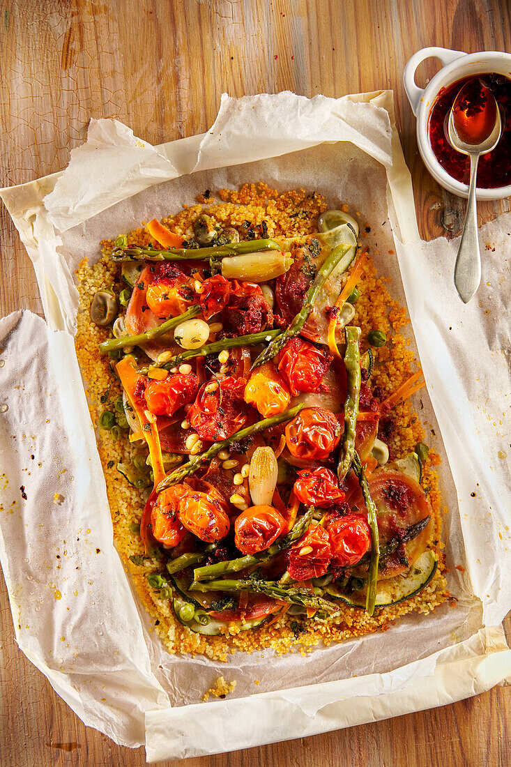 Couscous with vegetables and spices cooked in paper