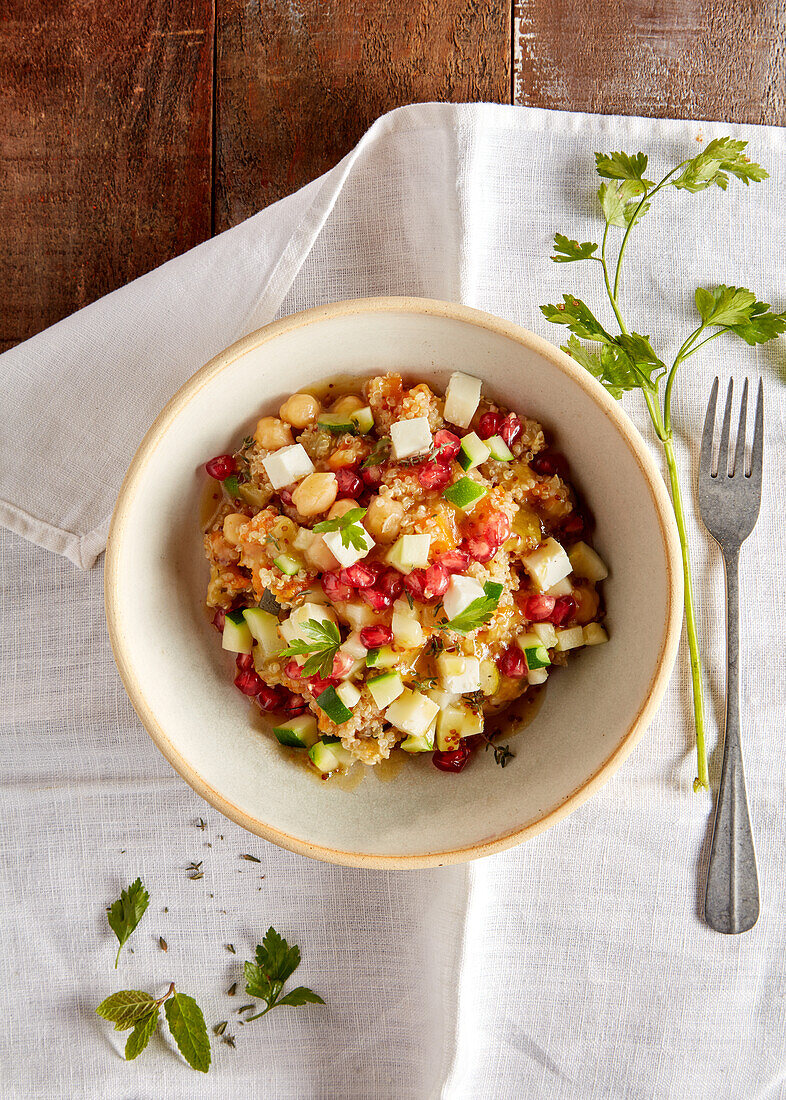 Quinoa salad with chickpeas, courgettes, feta and pomegranate seeds