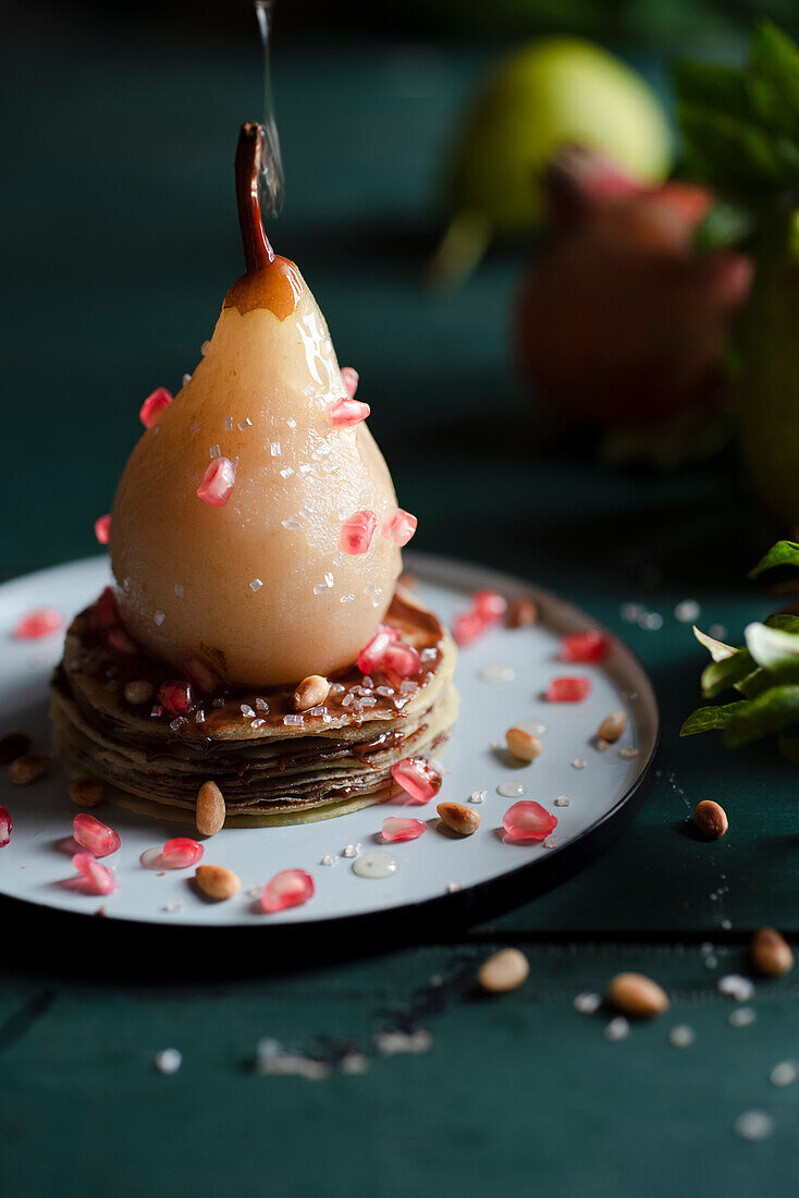 Roasted pear with pomegranate seeds
