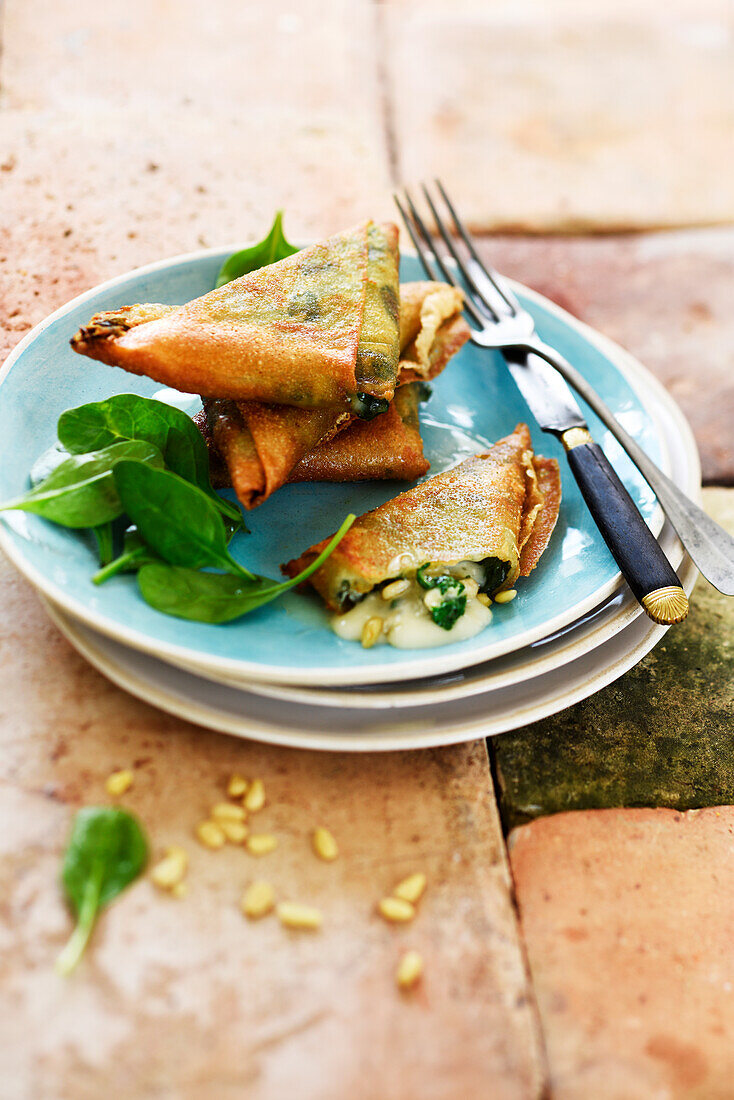 Samosas with gorgonzola, spinach, and pine nuts