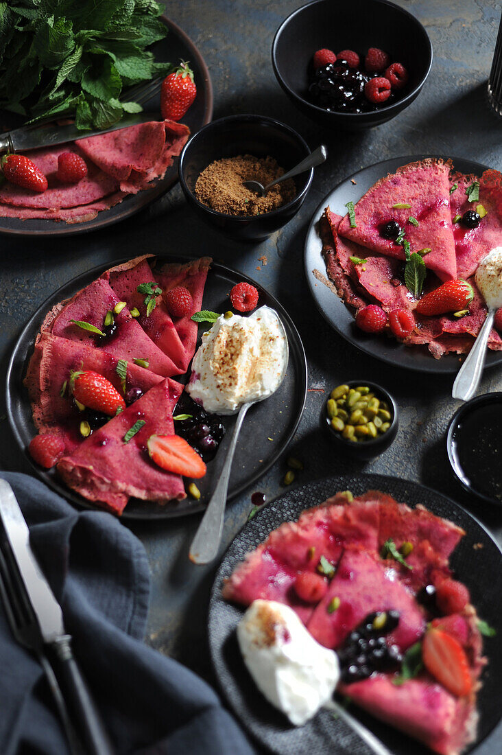 Sweet beet crêpes with red berries and cream