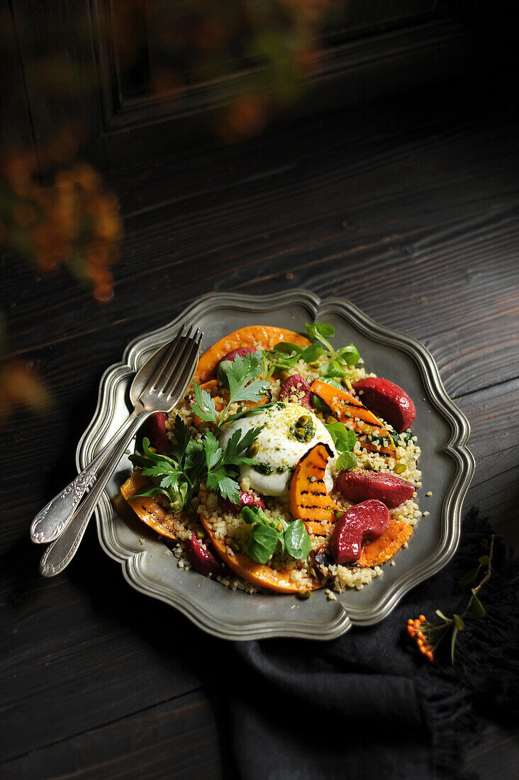 Autumn bulgur salad with grilled pumpkin and red apples