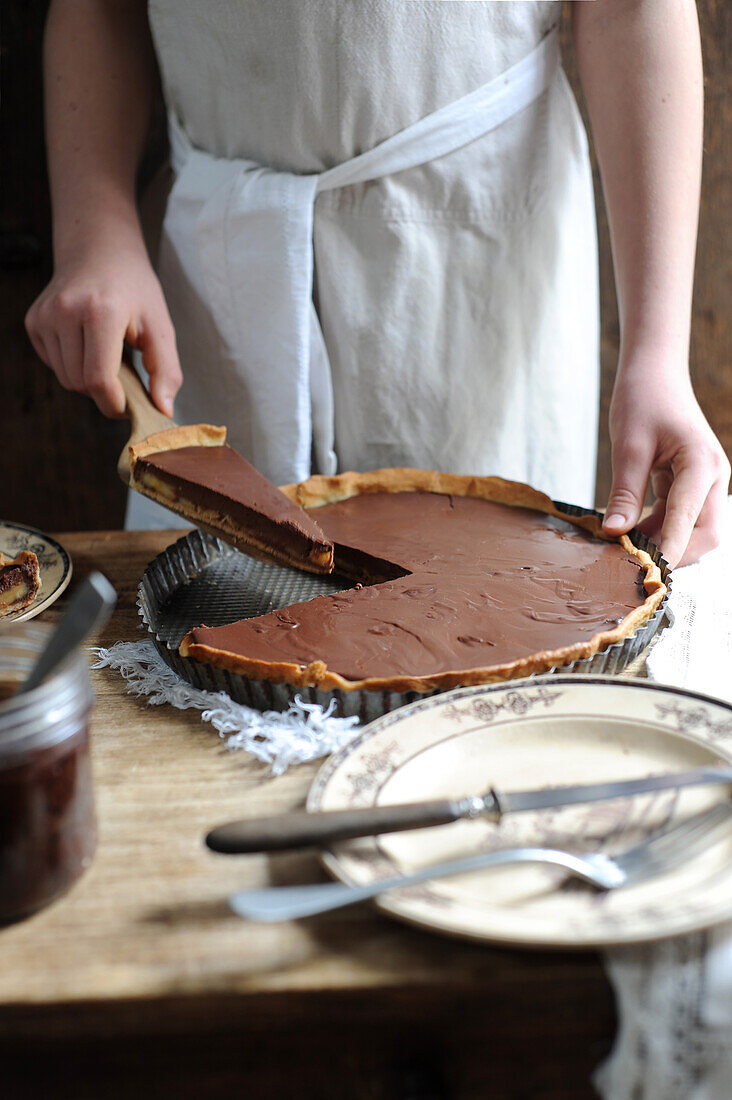 Serving chocolate banana tart