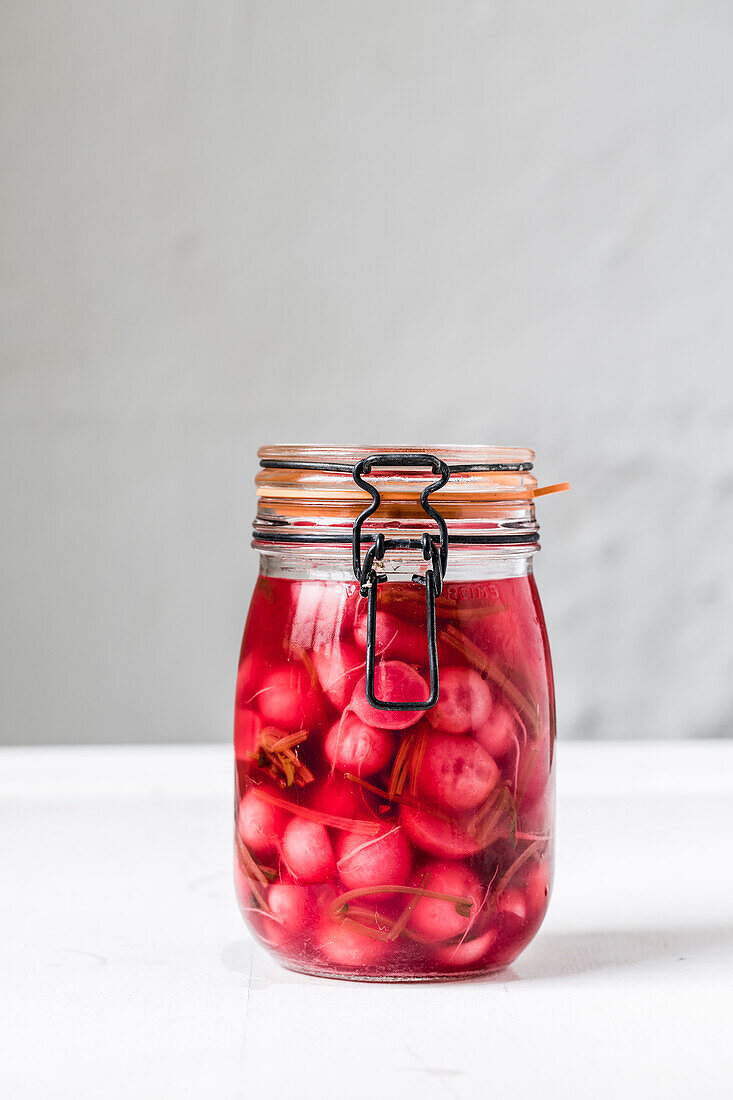 Fermented radishes in a jar