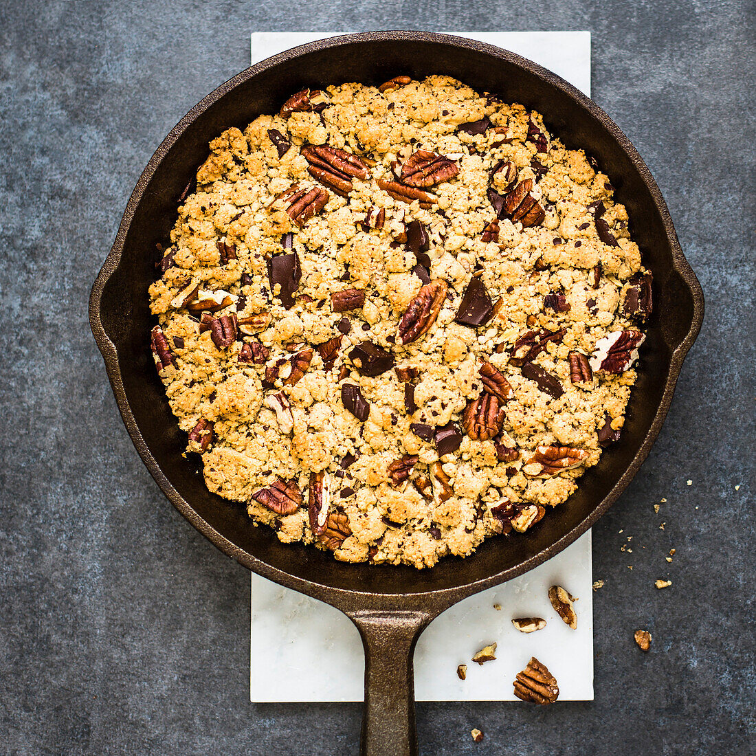 Cast iron skillet giant cookie with chocolate and pecans