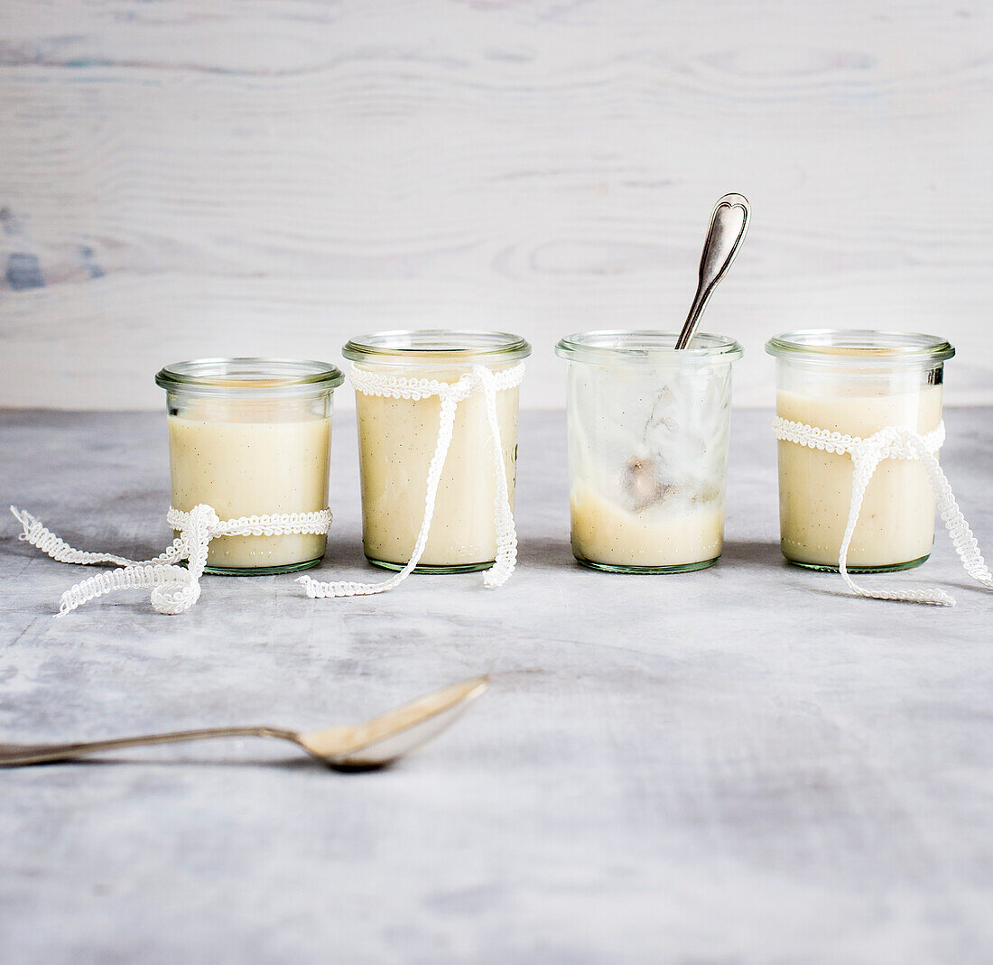 Cream dessert served in small glass jars