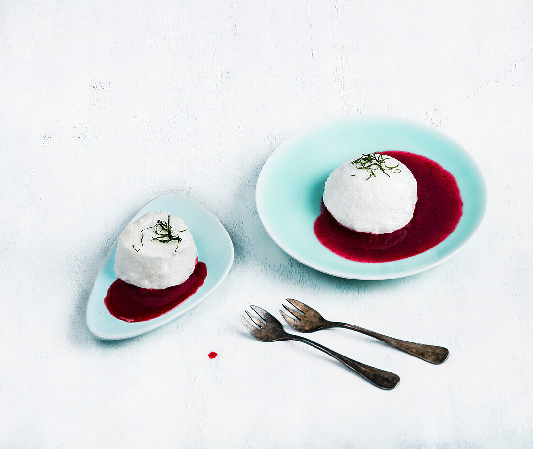Ile Flottante with red fruit coulis