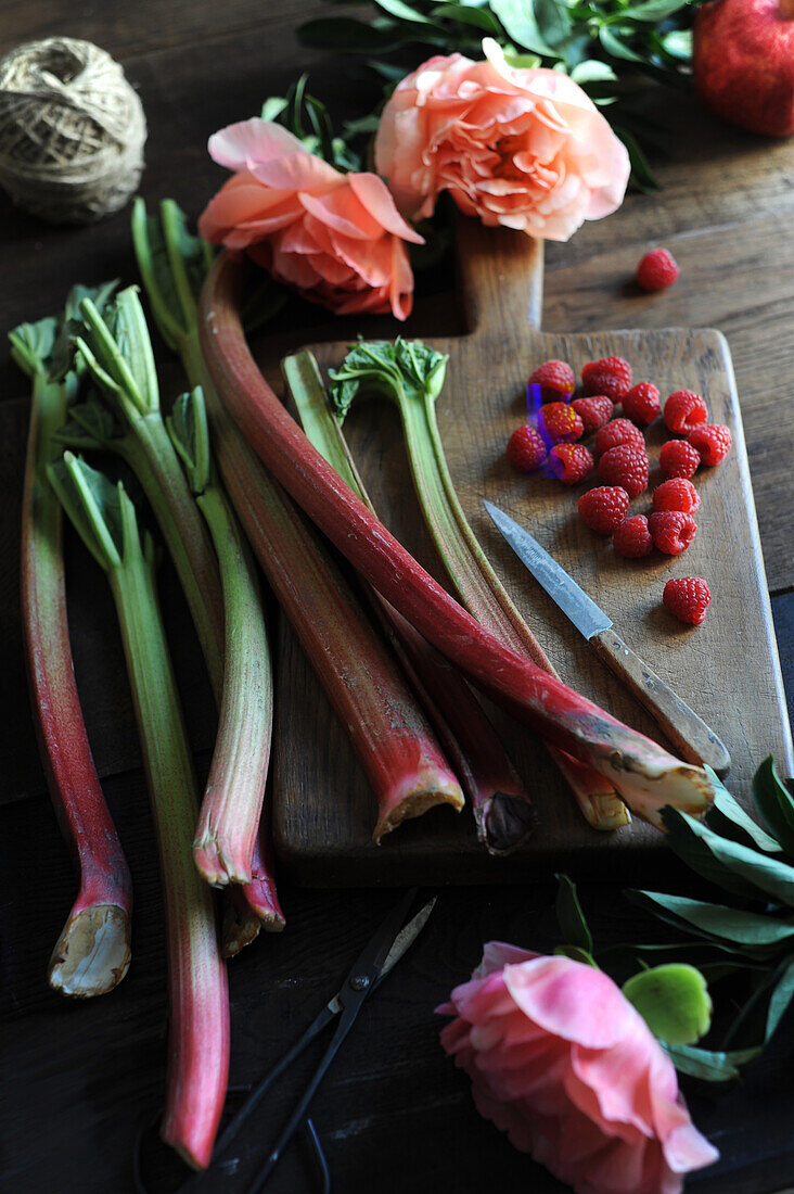 Still life with rhubarb, raspberries and peonies