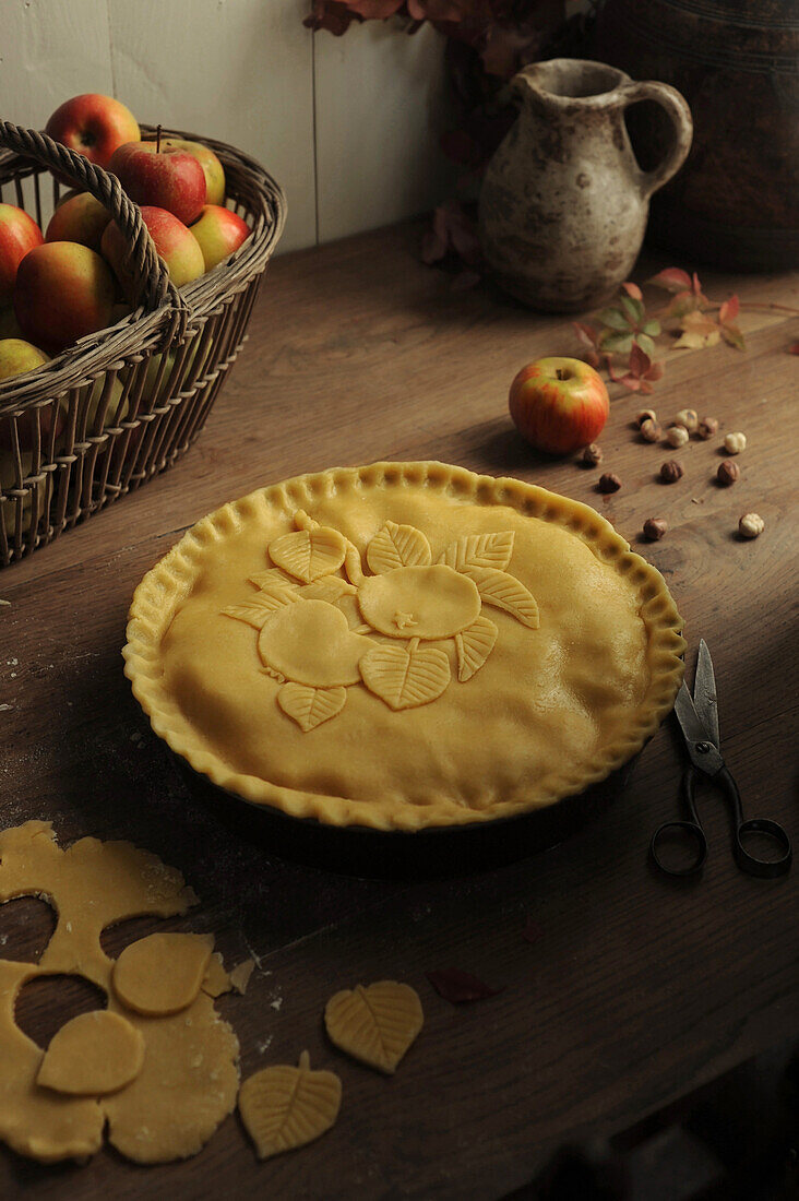 Preparing an apple and hazelnut pie