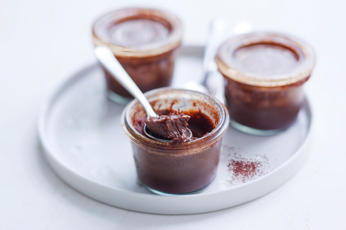 Chocolate cream in small glass jars