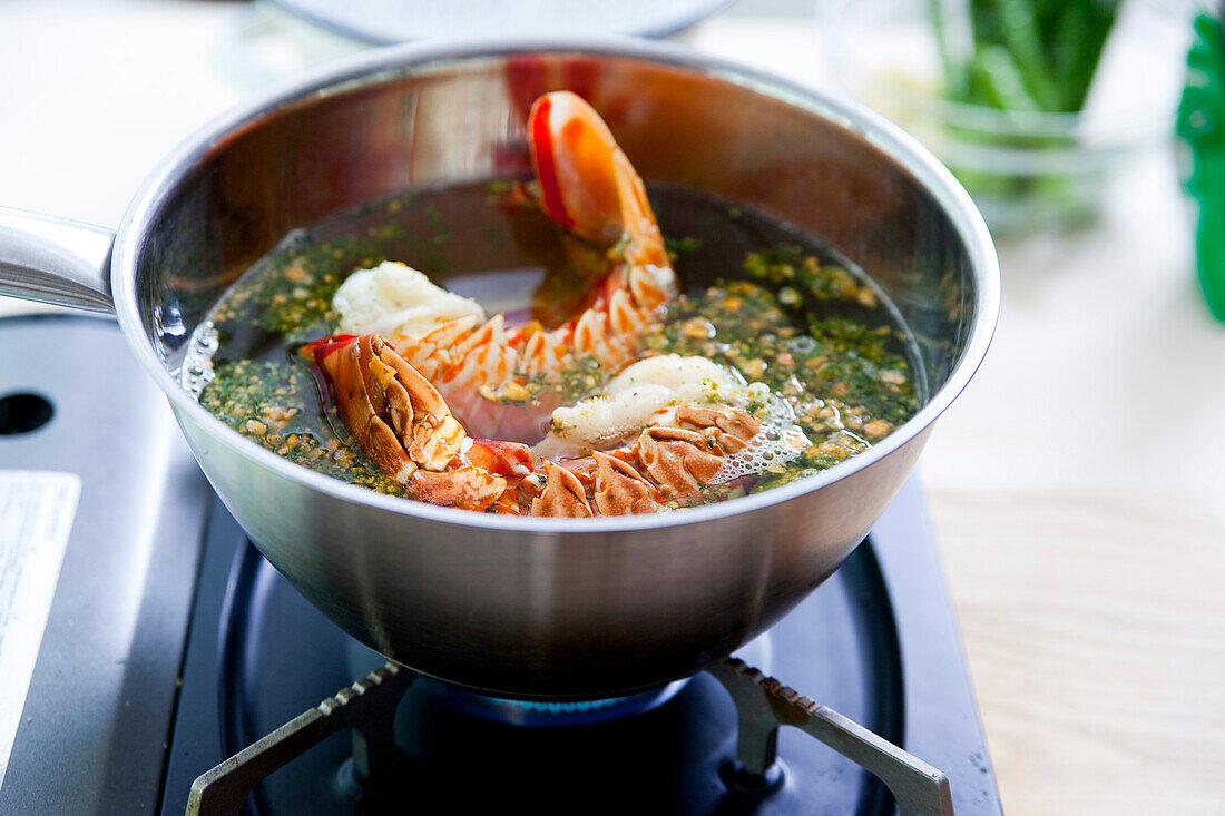 Prepare cream of asparagus soup with fried crayfish