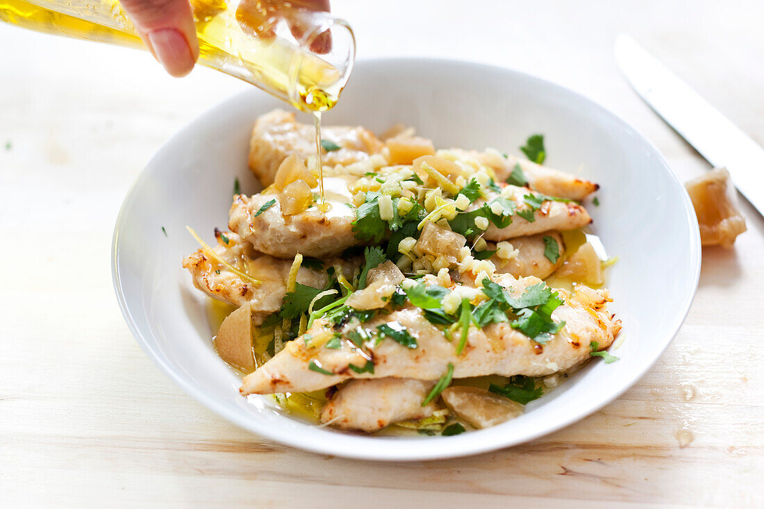 Chicken breast with lemon, herbs and oil