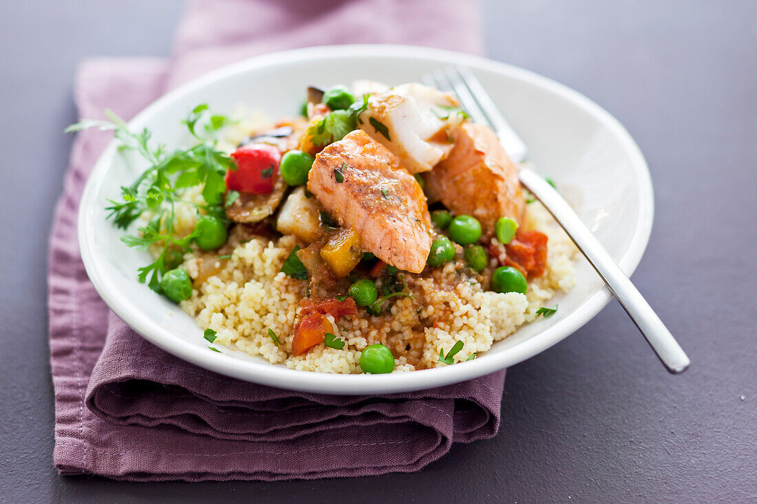 Fish tagine with vegetables on couscous