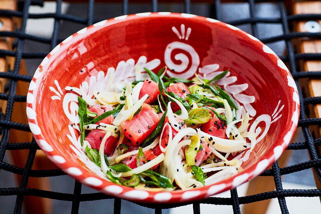 Raw tuna salad with chives and black sesame seeds