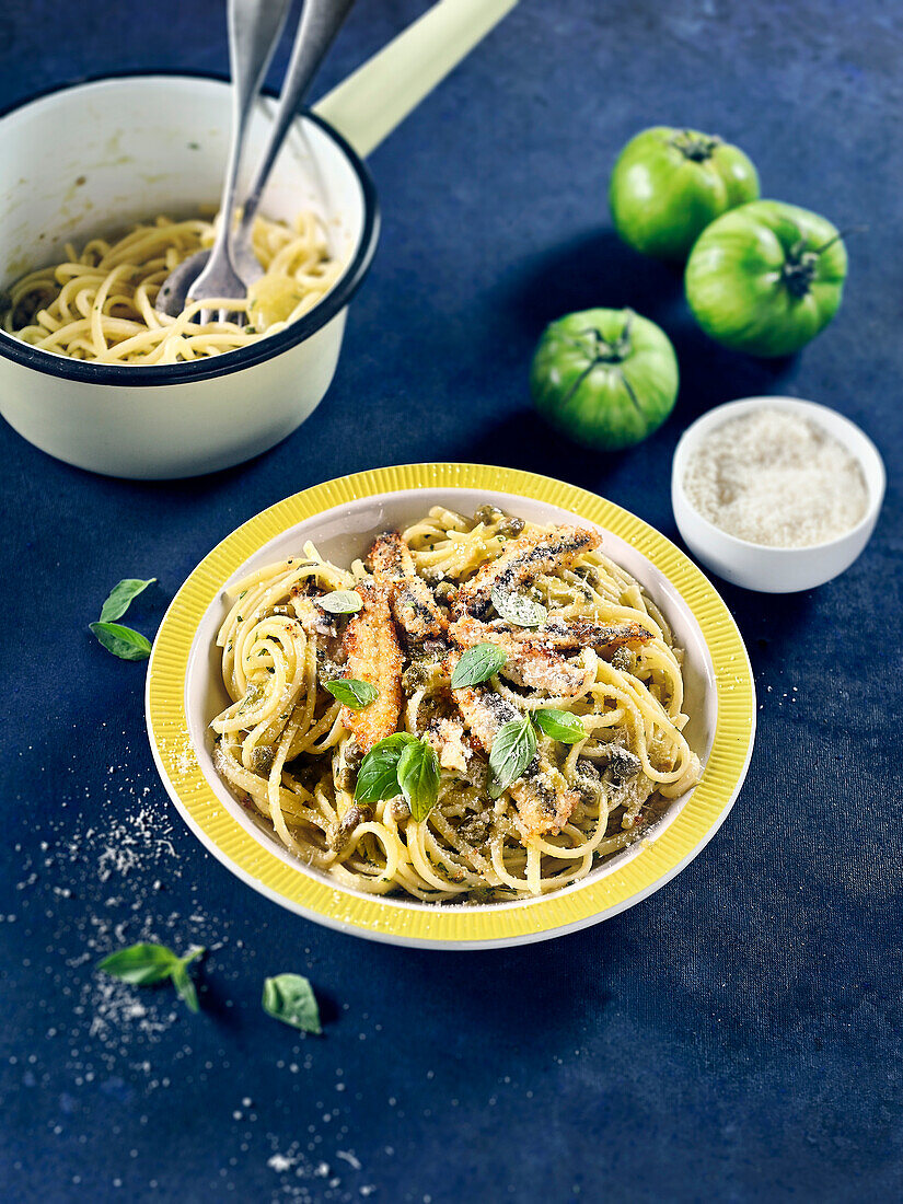 Linguine with breaded anchovies, green tomato sauce, basil and capers