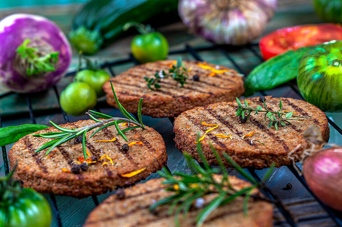 Veggie burgers on a grill grate