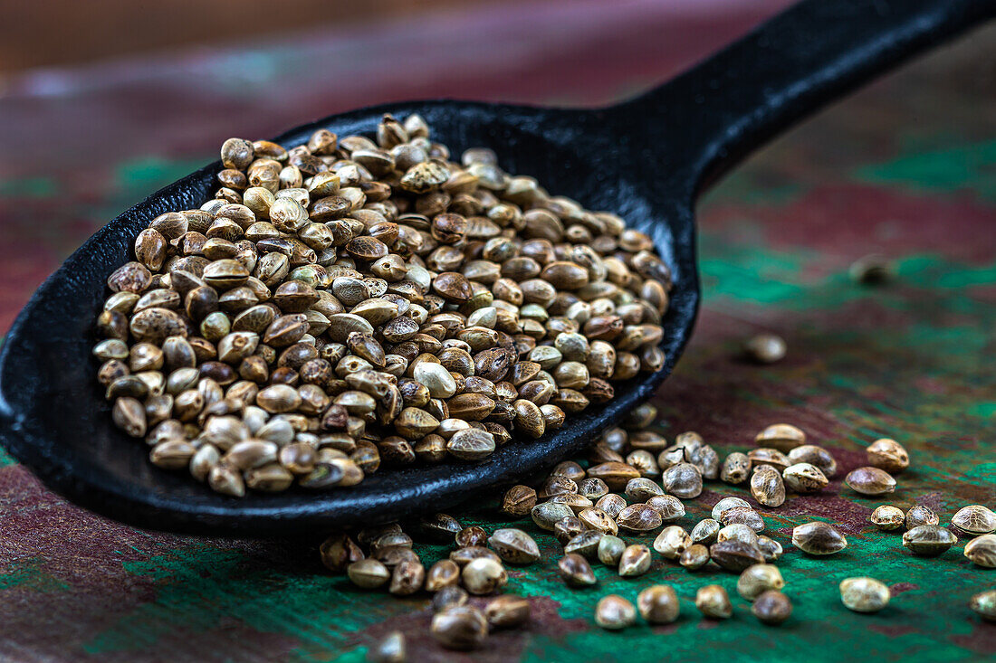 Hemp seeds on a wooden spoon