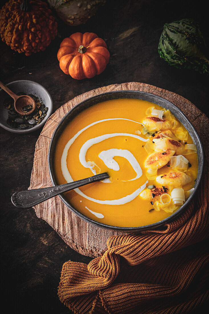 Cream of pumpkin soup with small dumplings